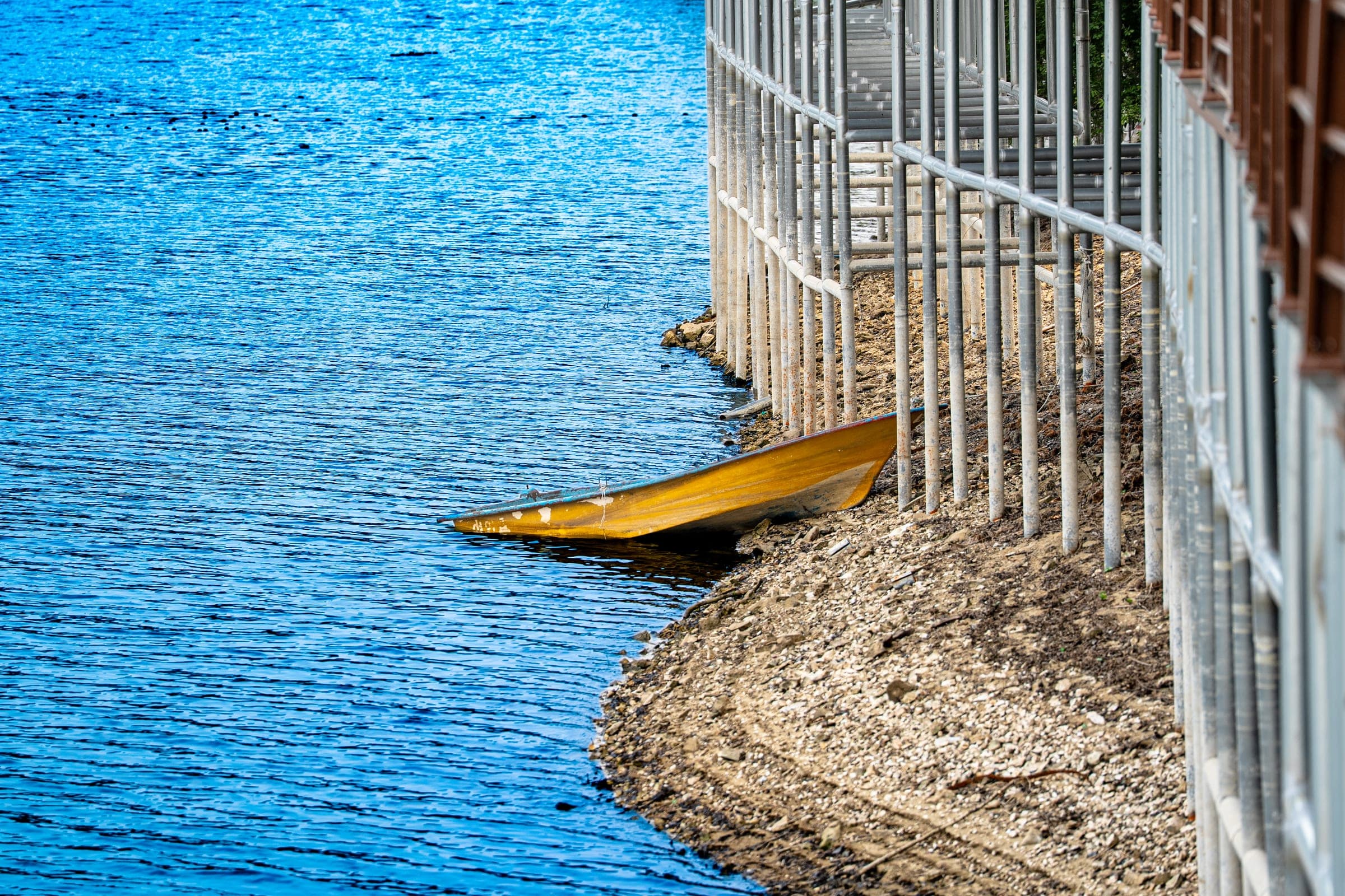 Yellow boat by the pier
